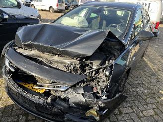 damaged passenger cars Opel Astra Sports Tourer 1.0 Online Edition 2017/6